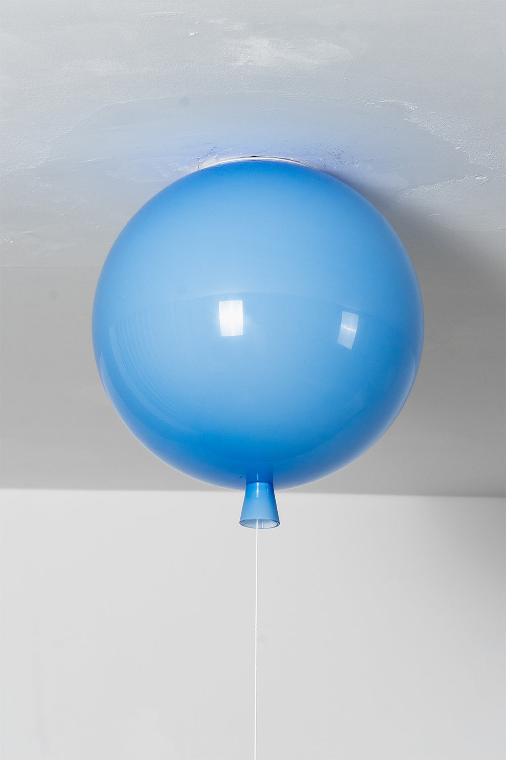 Glass Balloon Ceiling Light designed with a playful blue hand-blown glass orb, adding whimsy to modern spaces.