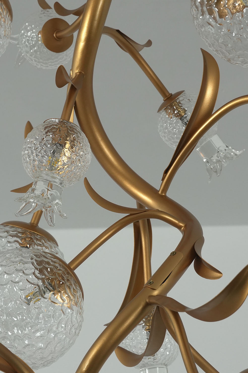 Grenaline Vine Chandelier | Brass and Art Glass | Close-up of cascading brass vines and glass pomegranates | Samu Lamp