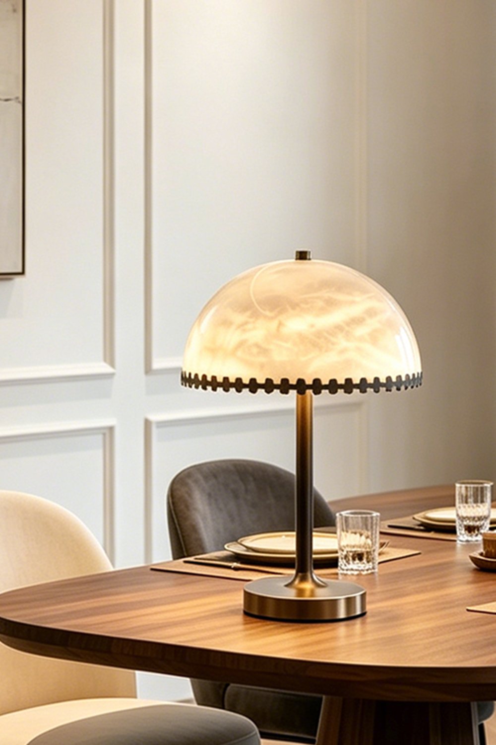 Helena Alabaster Trim Table Lamp | Cozy Dinner Lighting | Detailed view of the illuminated dome stone table lamp casting a warm yellow halo on a dark wood dining table | Samu Lamp