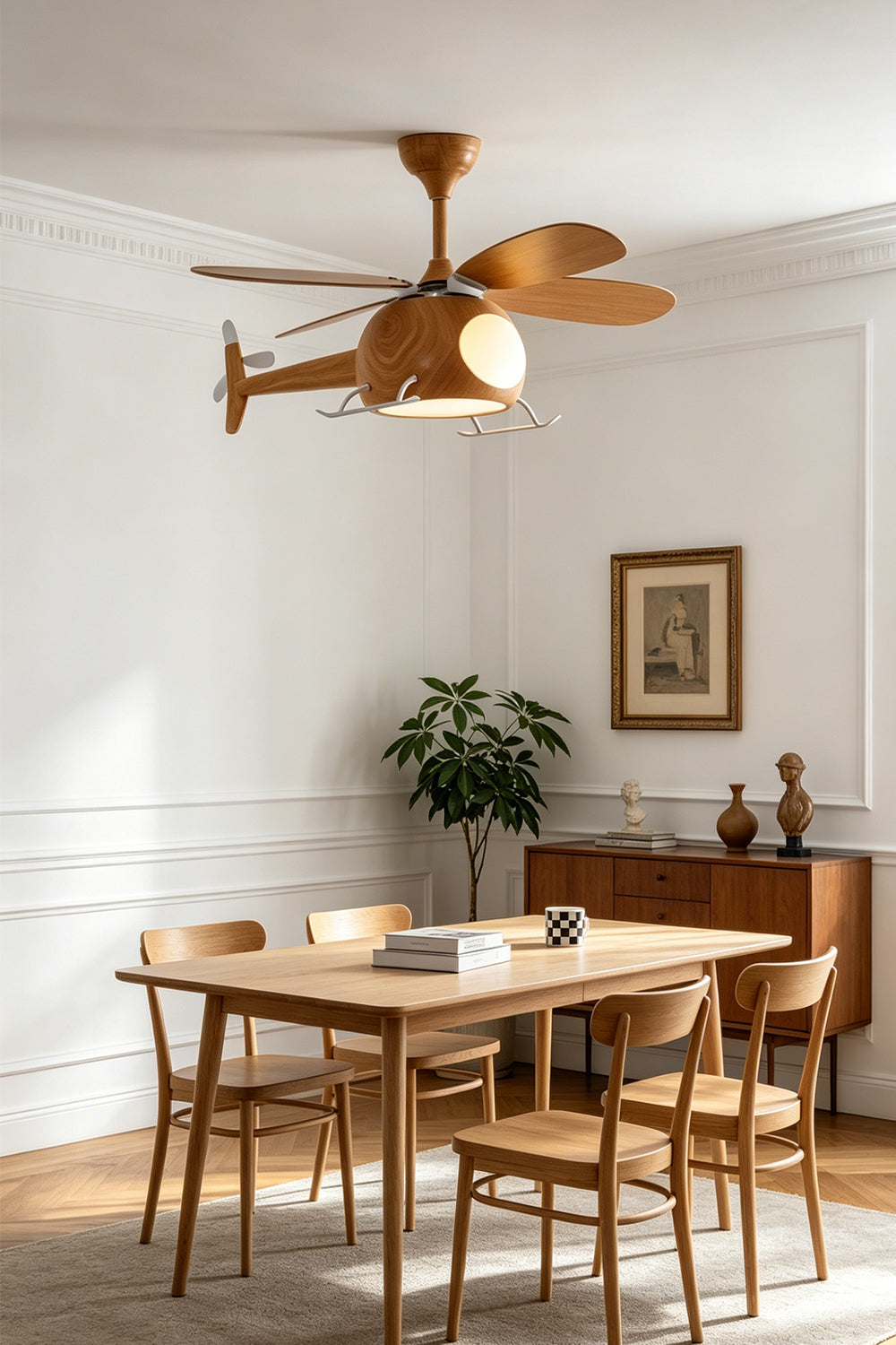 Heli Breeze Helicopter Ceiling Fan Light | Wood, Metal | Hanging as a playful centerpiece over a square wooden dining table with matching chairs in a bright, modern room | Samu Lamp