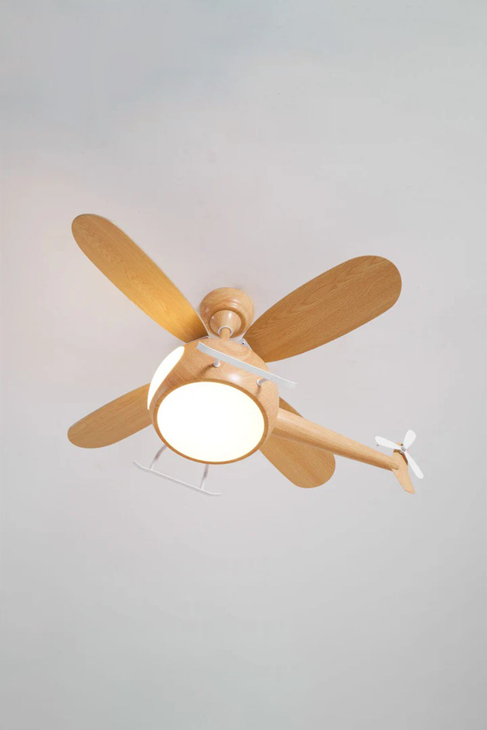 Heli Breeze Helicopter Ceiling Fan Light | Wood, Metal | Studio front view of the fully illuminated light oak wood helicopter fan variant casting a bright glow on a grey background | Samu Lamp