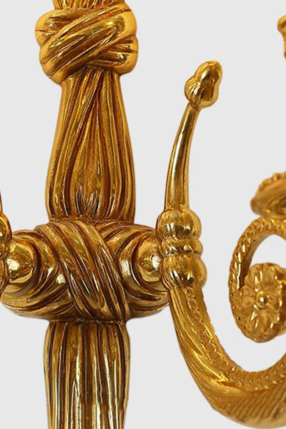 Honoria Rope and Tassel Brass Sconce | Brass and Metal | Close-up detail showing the intricate brass rope knot center structure | Samu Lamp