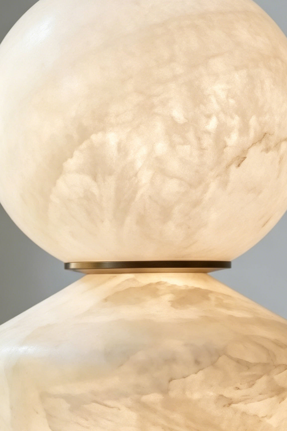 Top Sphere Detail | Alabaster, Brass | Close-up of the lit sphere and thin brass connection | Samu Lamp