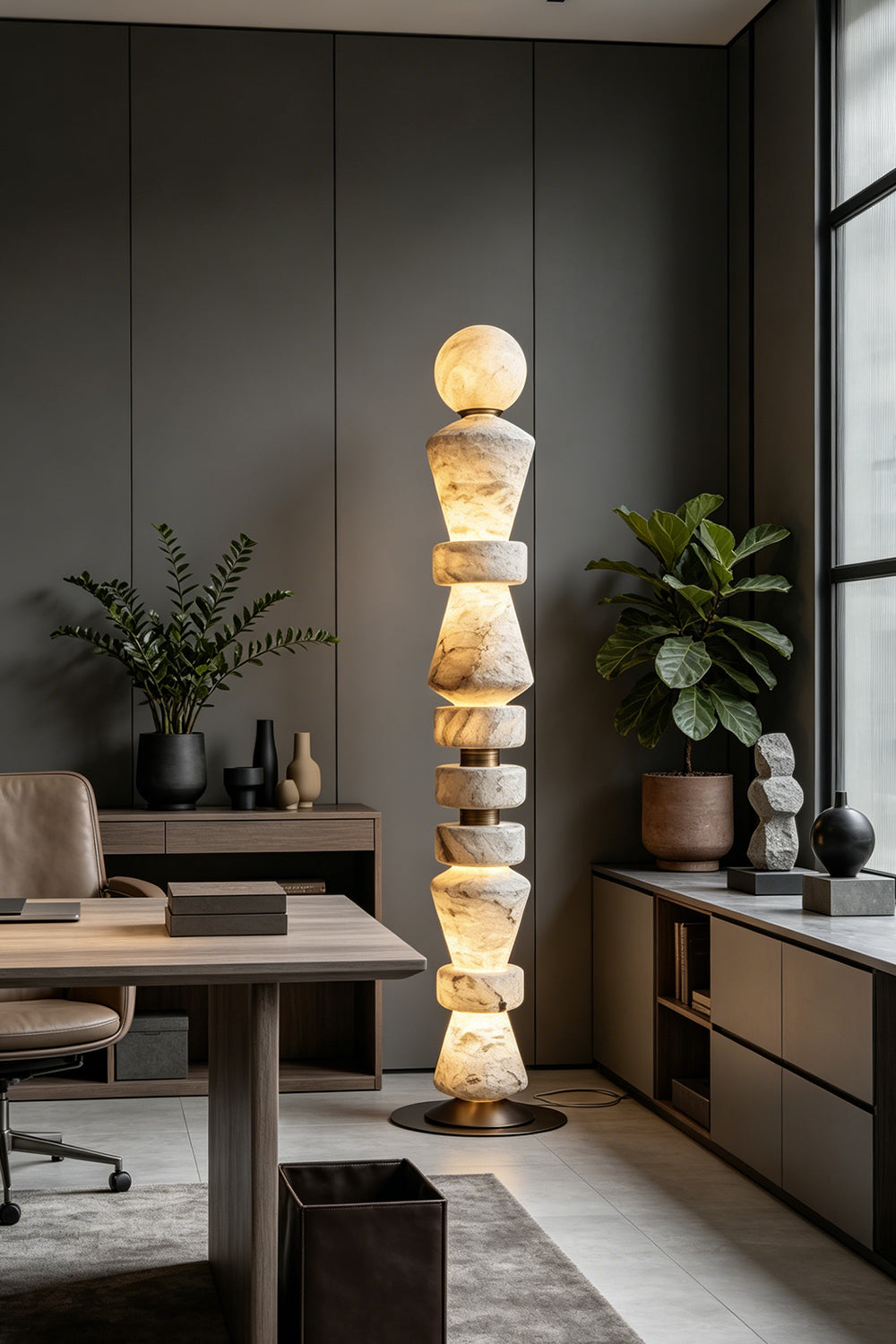 Horizon Obelisk Floor Lamp | Alabaster, Brass | Office workspace scene with wooden desk and bookshelves | Samu Lamp