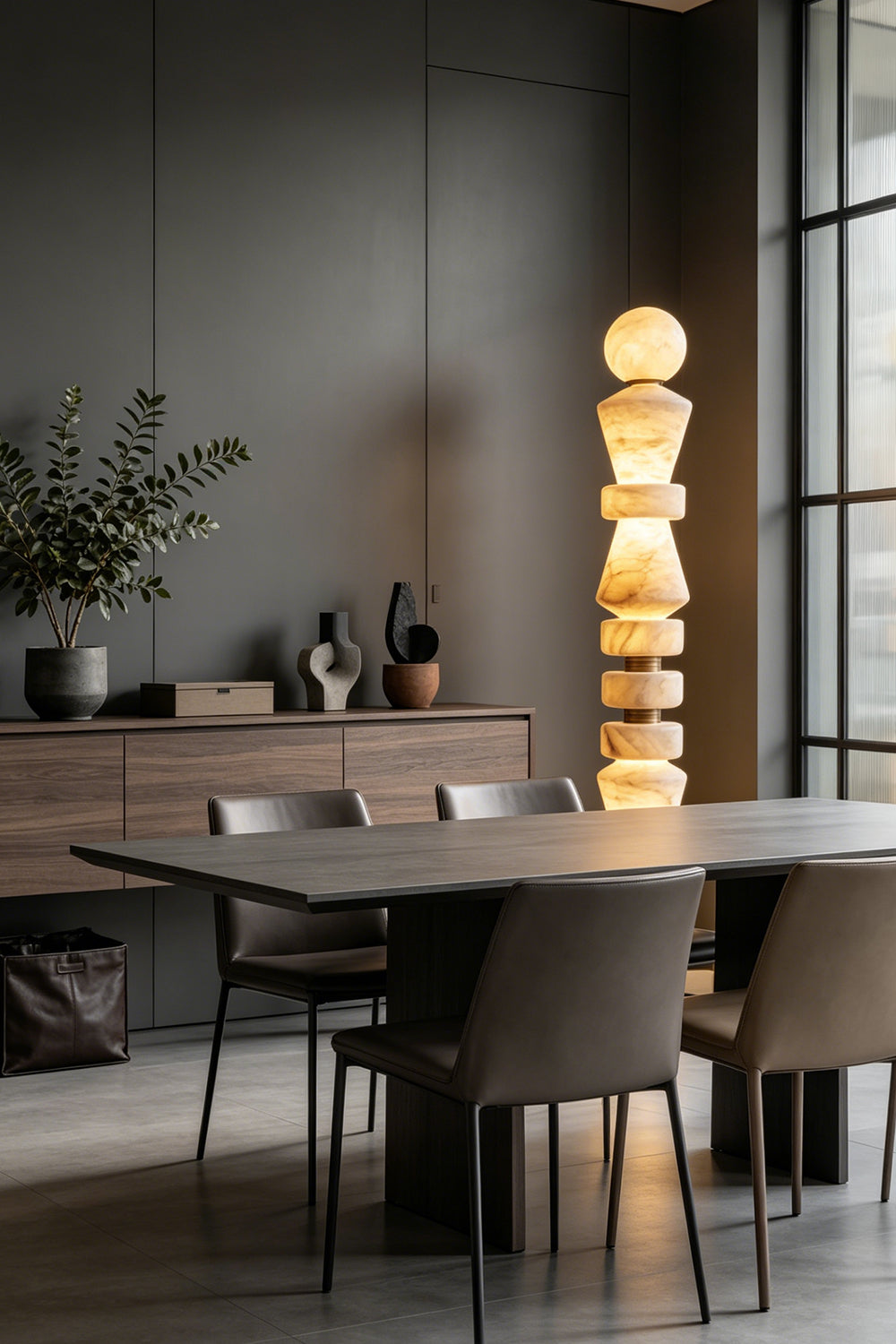 Horizon Obelisk Floor Lamp | Alabaster, Brass | Elegant dining room scene over a large table with chairs | Samu Lamp
