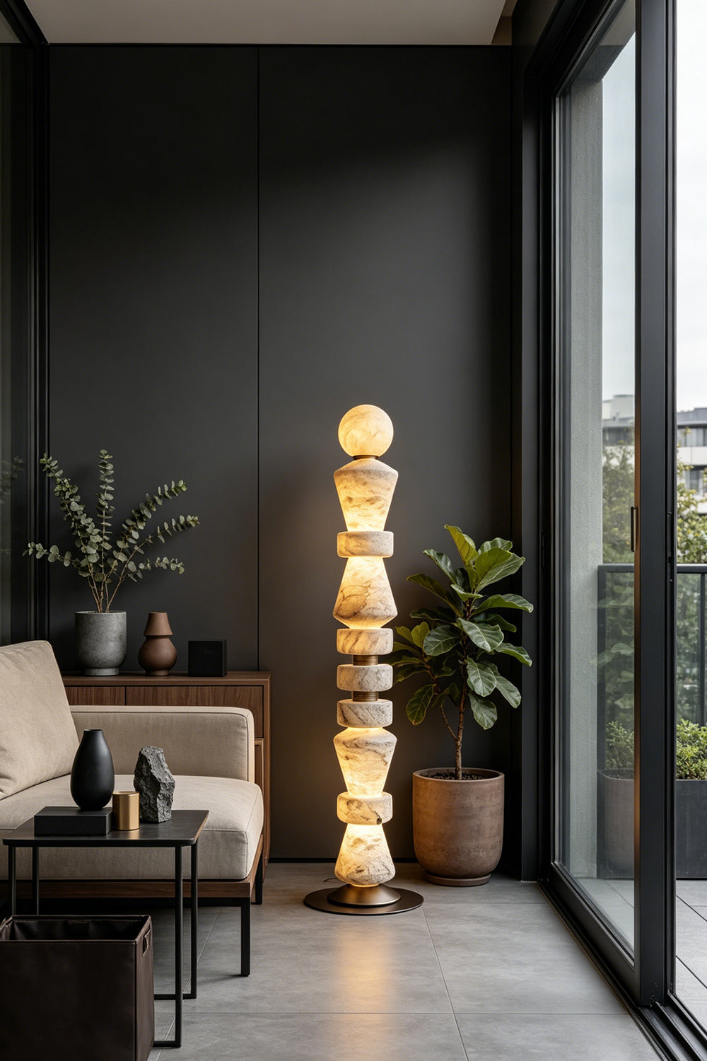 Horizon Obelisk Floor Lamp | Alabaster, Brass | Lit next to a large window in a modern lounge | Samu Lamp