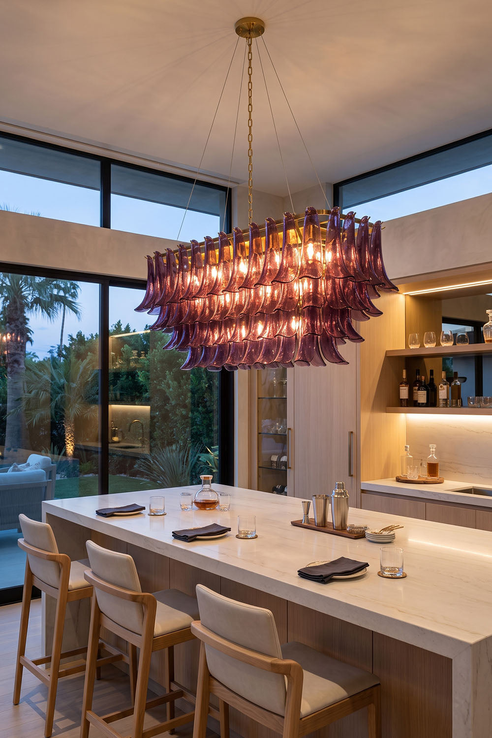 Ilvesse Amethyst Glass Petal Rectangular Chandelier | Amethyst Glass and Brass | Suspended over a kitchen island counter in a modern open-concept space | Samu Lamp