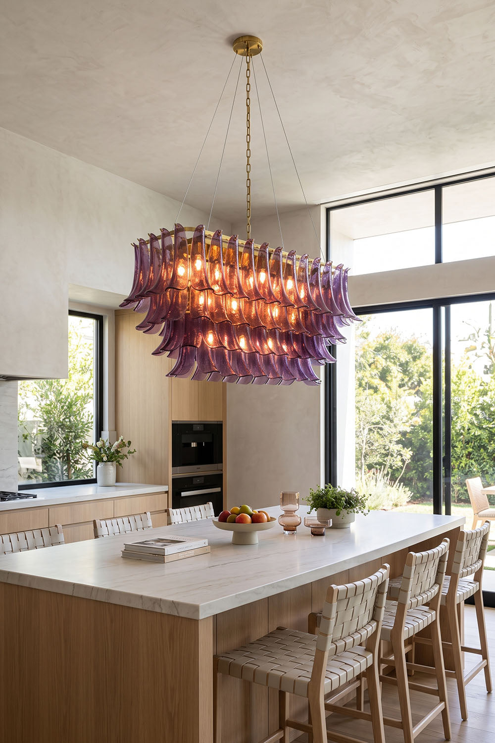 Ilvesse Amethyst Glass Petal Rectangular Chandelier | Amethyst Glass and Brass | Displayed in a bright contemporary kitchen above a wooden island | Samu Lamp
