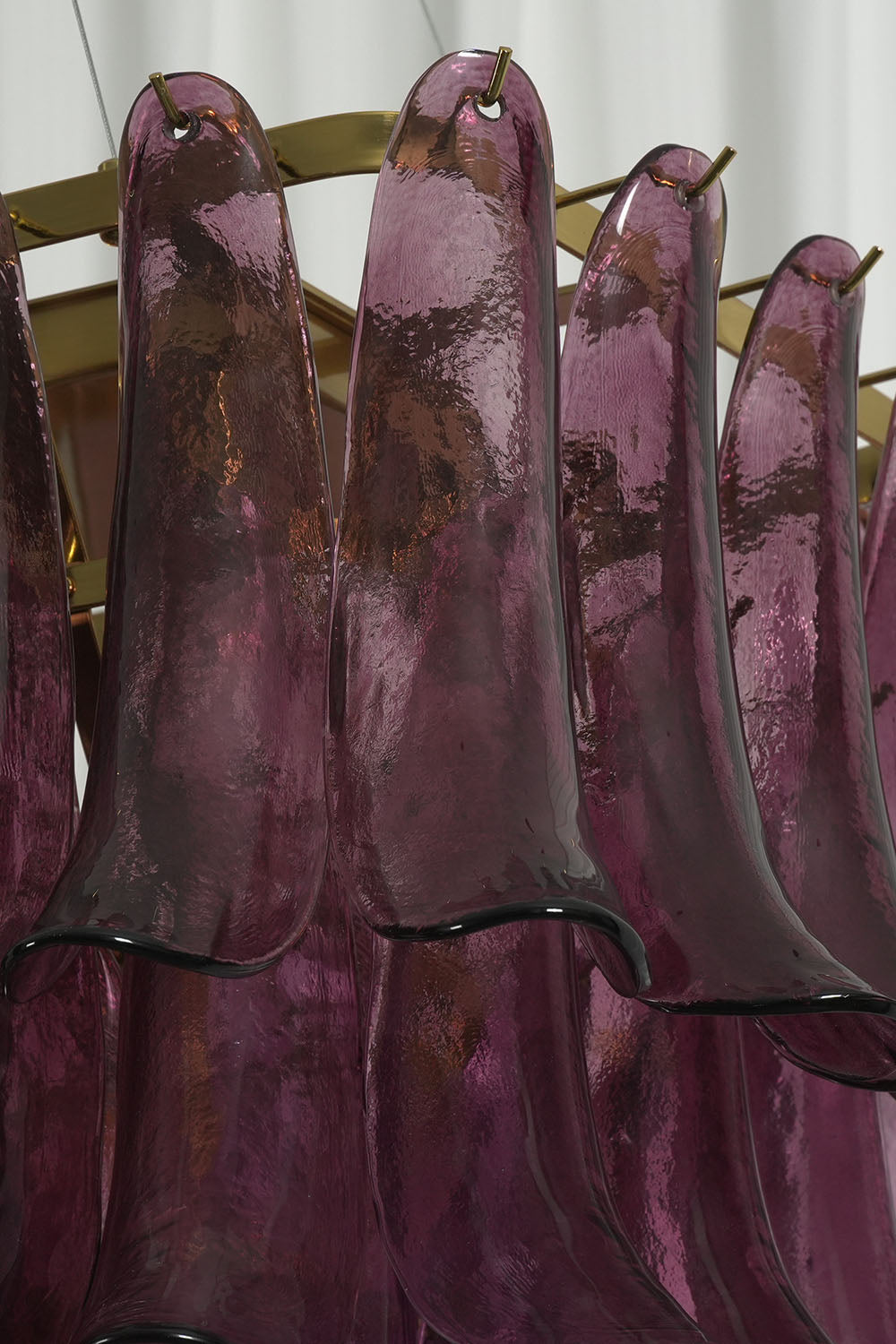 Ilvesse Amethyst Glass Petal Rectangular Chandelier | Amethyst Glass and Brass | Close-up detail of purple glass petal shades mounted on brass brackets | Samu Lamp