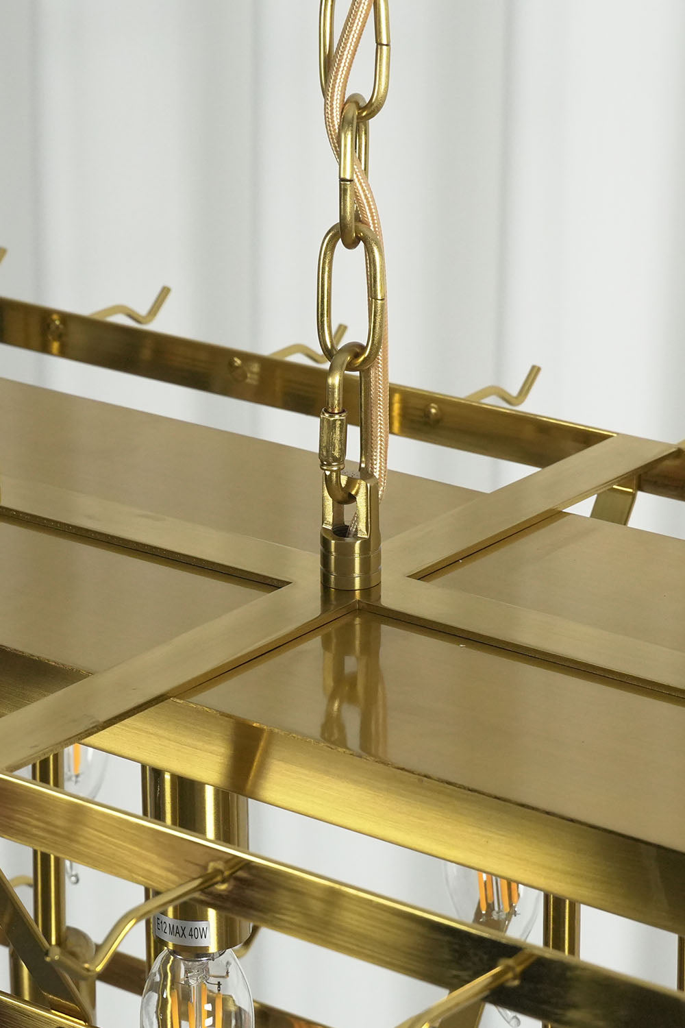 Ilvesse Amethyst Glass Petal Rectangular Chandelier | Amethyst Glass and Brass | Close-up of top rectangular brass frame and hanging chain hardware | Samu Lamp