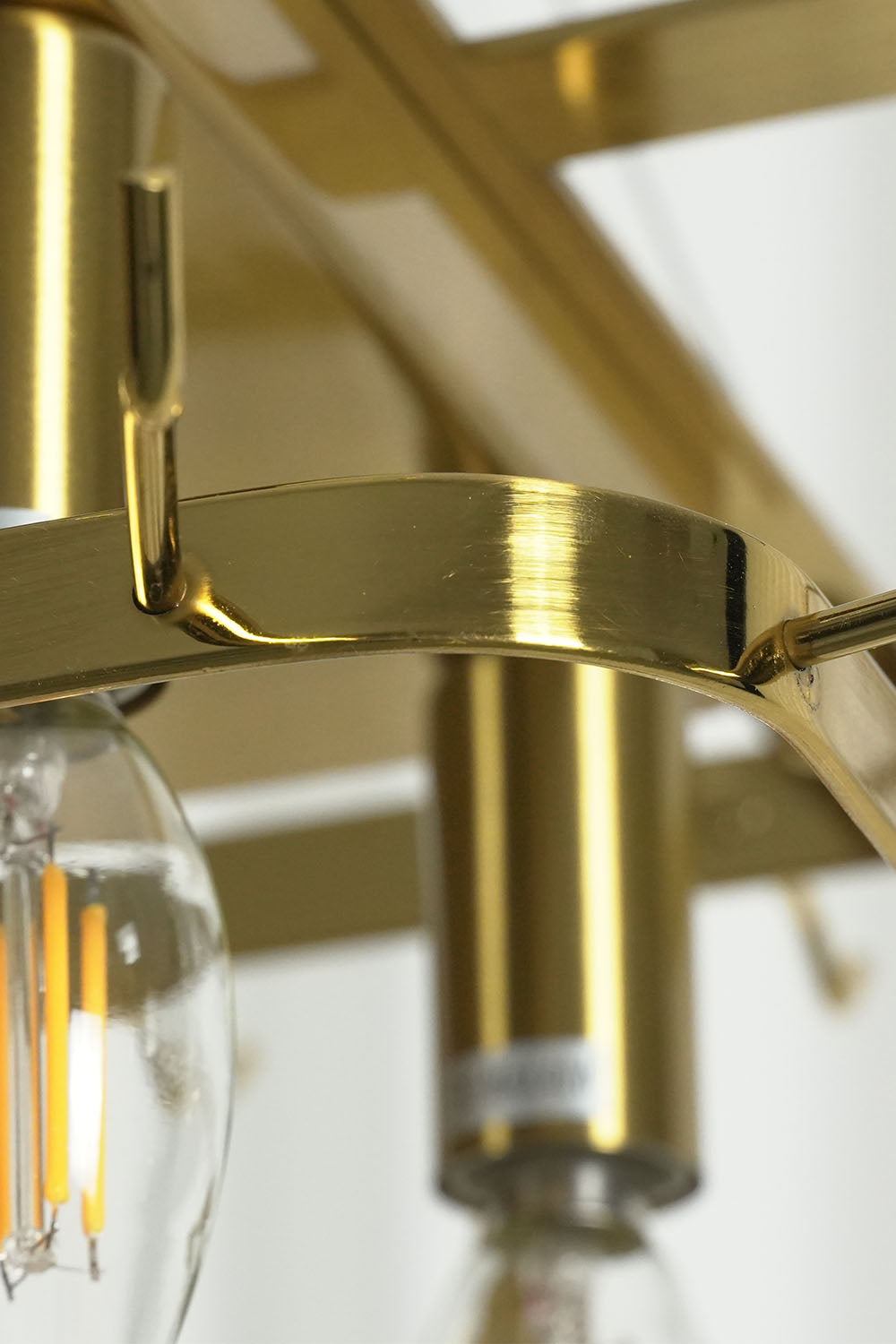 Ilvesse Amethyst Glass Petal Rectangular Chandelier | Amethyst Glass and Brass | Detail shot showing the brass bulb sockets and frame support structure | Samu Lamp
