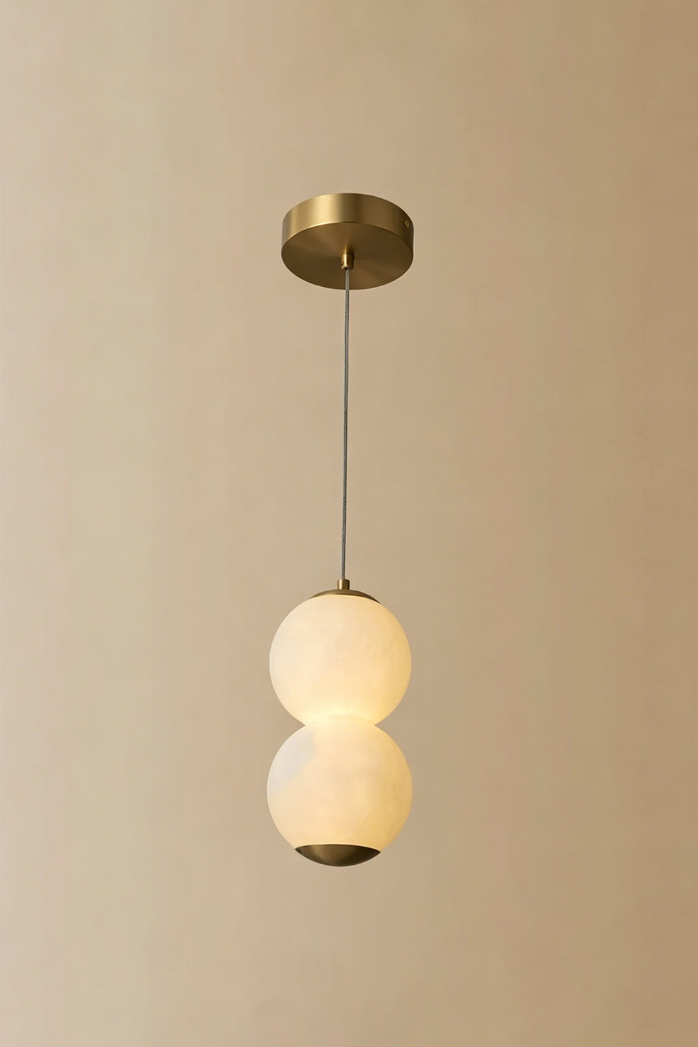 Imperial Epoch Alabaster Pendant Lamp | Metal, Alabaster | Full view of the two-sphere pendant variant against a beige background | Samu Lamp