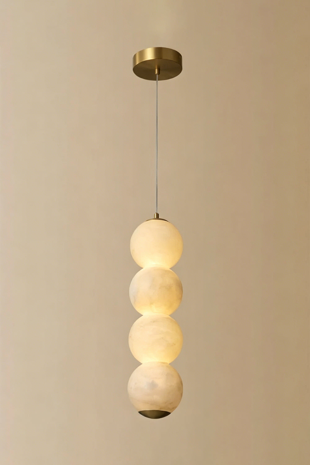 Imperial Epoch Alabaster Pendant Lamp | Metal, Alabaster | Full view of the four-sphere pendant variant against a beige background | Samu Lamp