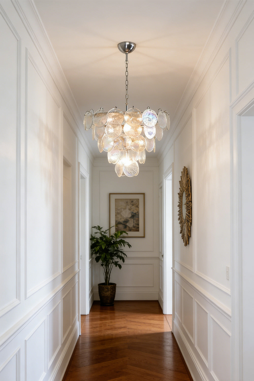 Cascading glass disc chandelier | Metal, Glass | Installed in a high-ceiling hallway corridor | Samu Lamp