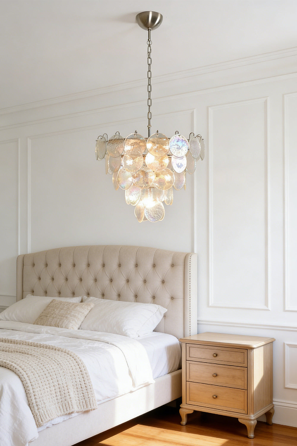 Serene iridescent glass chandelier | Metal, Glass | Mounted in a master bedroom above a tufted bed | Samu Lamp