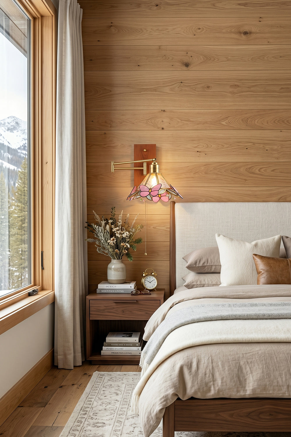 Iris Butterfly Stained Glass Wall Lamp | Stained Glass, Metal, Wood | Mounted as a charming vintage bedside reading light on a rustic wood-paneled wall in a cozy cabin bedroom with soft beige bedding | Samu Lamp