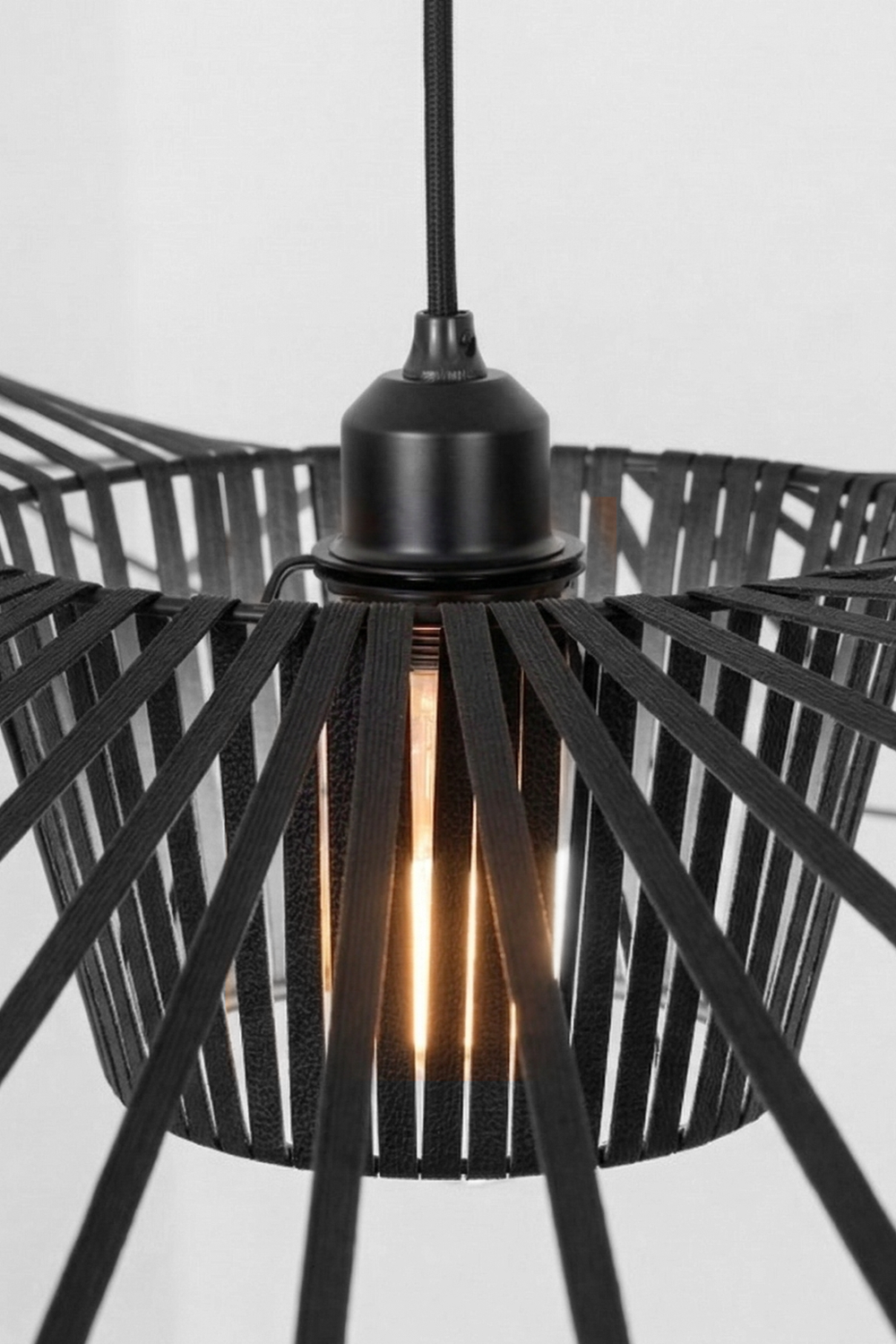 Lit hat-shaped pendant with warm bulb | Metal | Polyurethane elastic cloth | Glass fiber | Close-up of the internal cage and warm glow | Samu Lamp