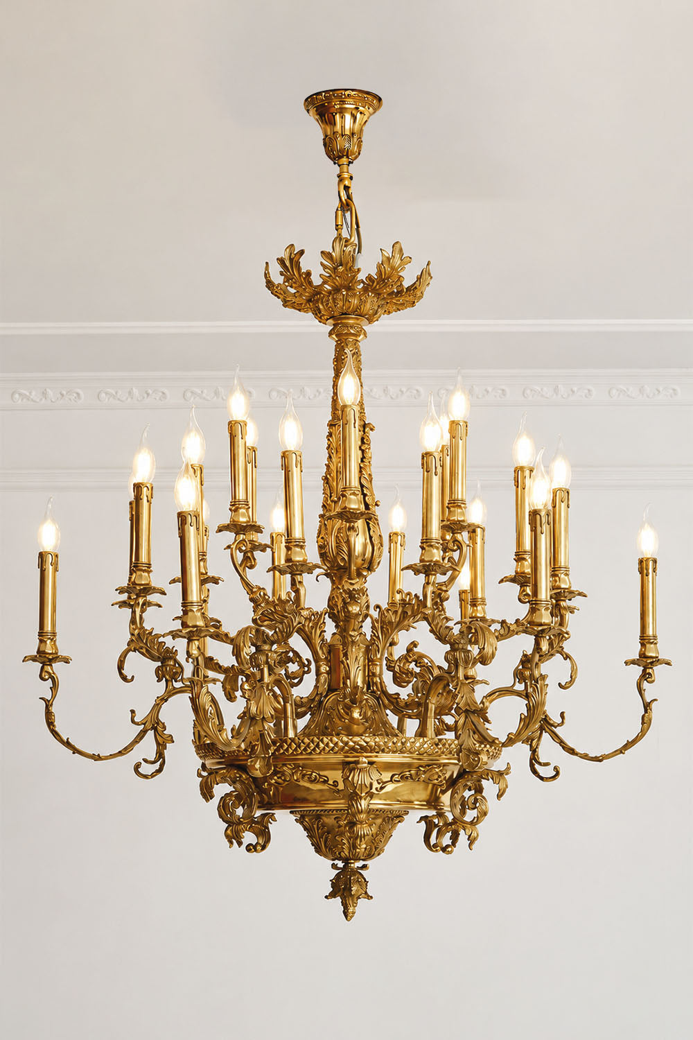 Percival Grand Brass Candelabra Chandelier showcasing intricate details and multiple candle-like lights in a classic design.