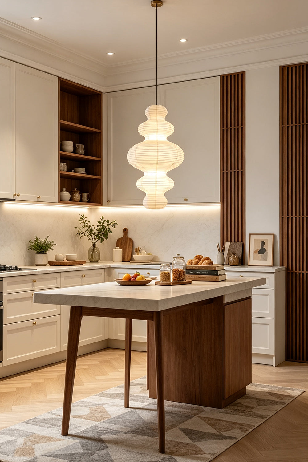 Isolde Stacked Paper Pendant Lamp | Textured Ribbed Paper | Suspended over a contemporary kitchen island with wooden bar stools and white cabinets | Samu Lamp