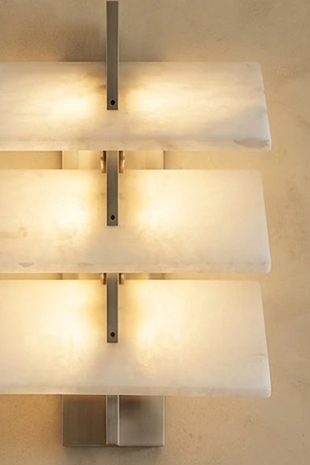 Isolde Tiered Alabaster Slab Wall Sconce featuring three horizontal layers of natural alabaster in a brushed nickel frame