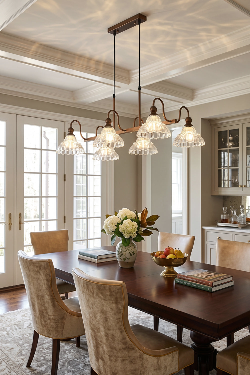 Isolde Vintage Glass Long Chandelier | Formal Dining Area | Positioned elegantly above a long traditional dining table surrounded by high-back cane chairs in a bright room | Samu Lamp