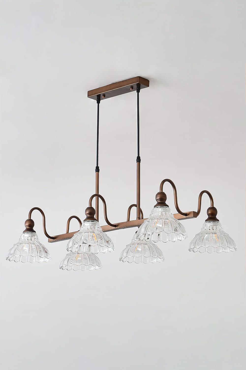 Isolde Vintage Glass Long Chandelier | Studio Lit View | Fully illuminated multi-light vintage linear pendant lamp casting a bright ambient glow against a clean white backdrop | Samu Lamp