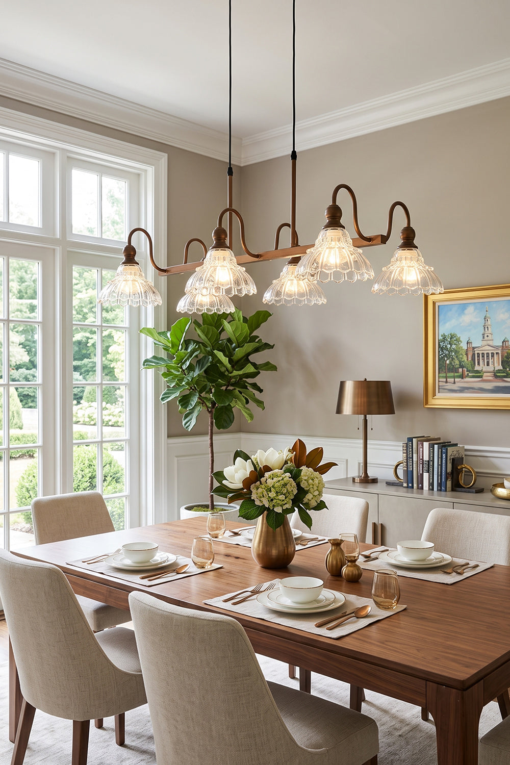 Isolde Vintage Glass Long Chandelier | Linear Dining Light | Hanging elegantly as a classic centerpiece over a rich rectangular wood dining table paired with neutral upholstered chairs in a sunlit room | Samu Lamp