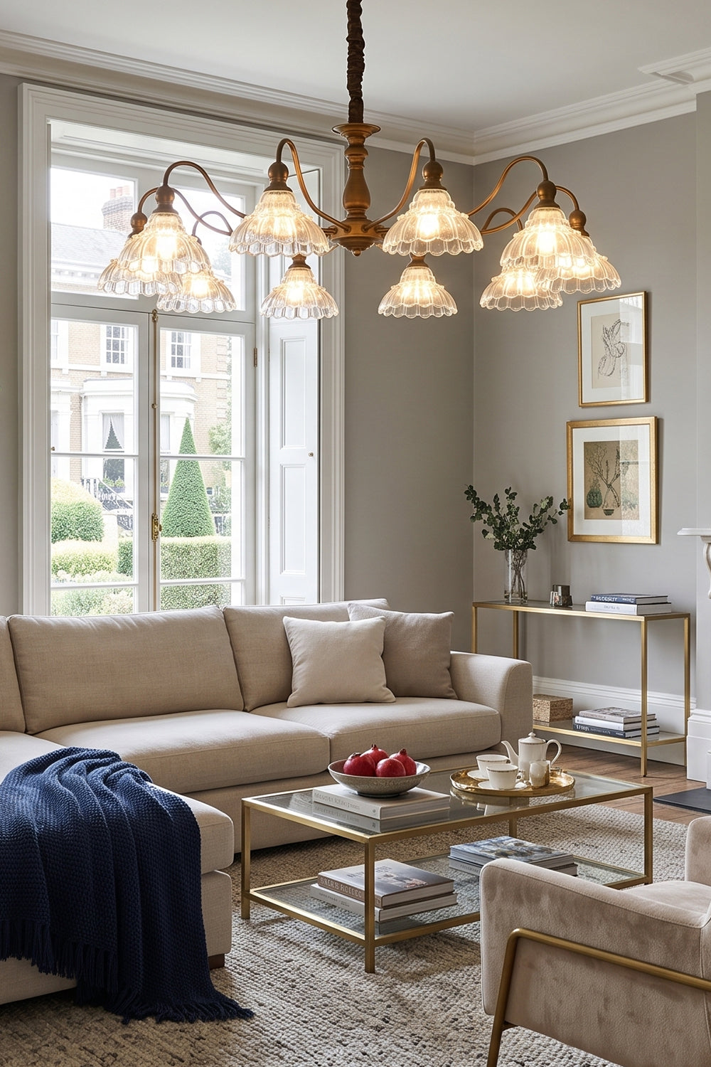 Isolde Vintage Scalloped Glass Chandelier | Cozy Sitting Area | Staged overhead in a classical living space casting a soft glow near a cream sofa with a navy blue blanket accent | Samu Lamp