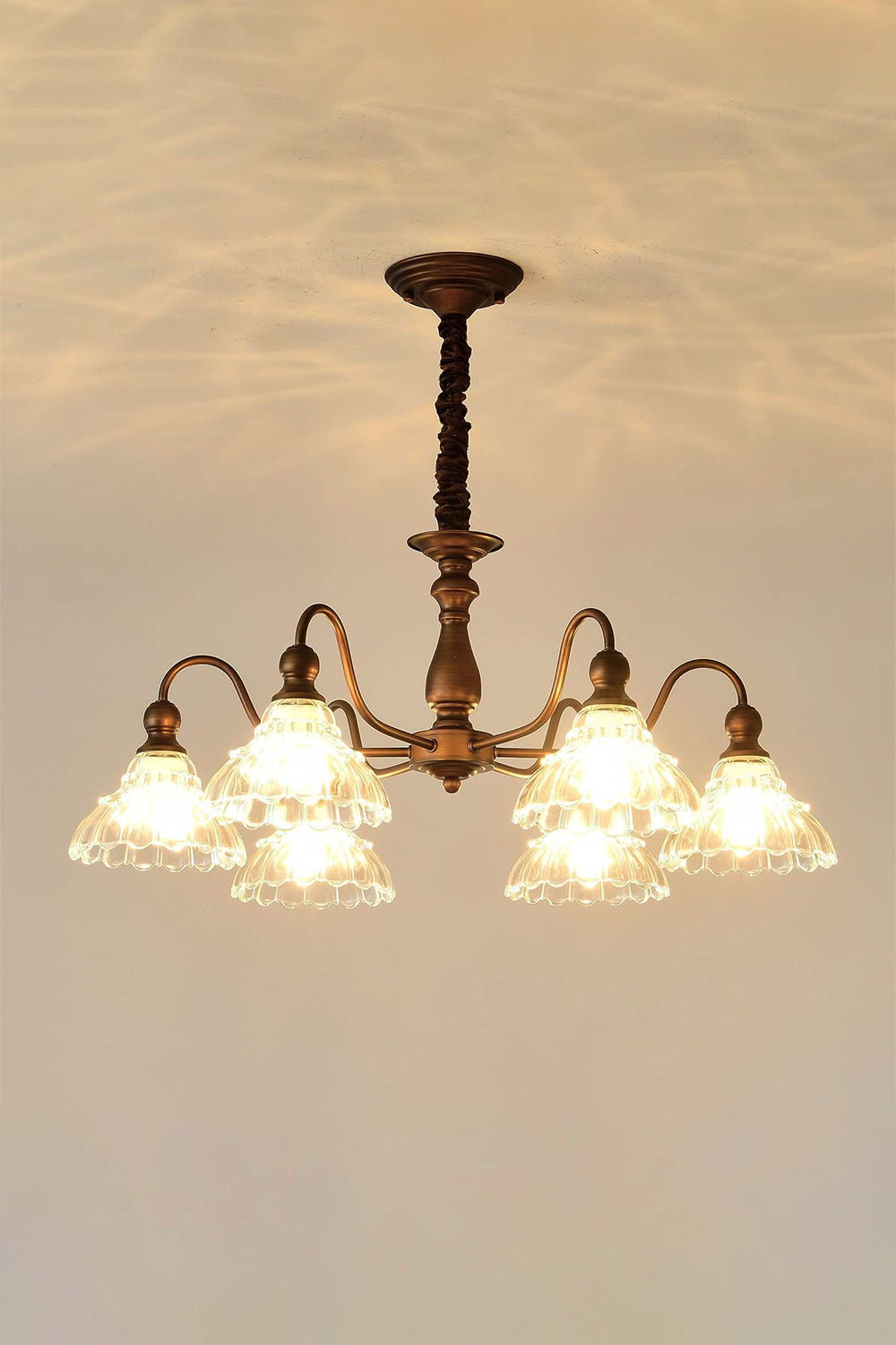Isolde Vintage Scalloped Glass Chandelier | Dimmed Mood View | Low-light presentation of the fully lit scalloped glass fixture showcasing the warm glowing bulb filaments inside | Samu Lamp
