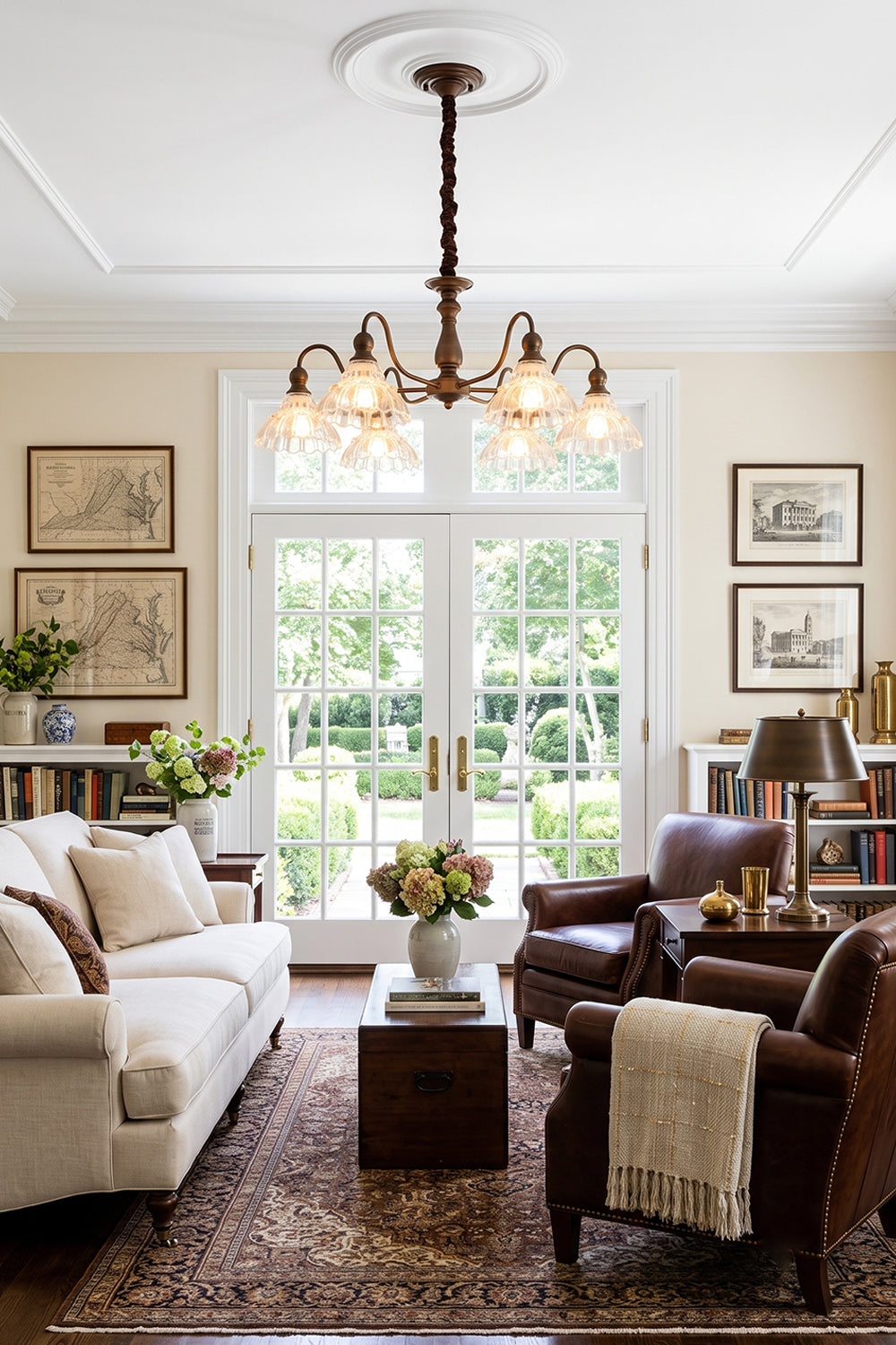 Isolde Vintage Scalloped Glass Chandelier | Classical Living Room | Providing warm ambient lighting in an elegant traditional lounge room with a white sofa and plush leather armchairs | Samu Lamp