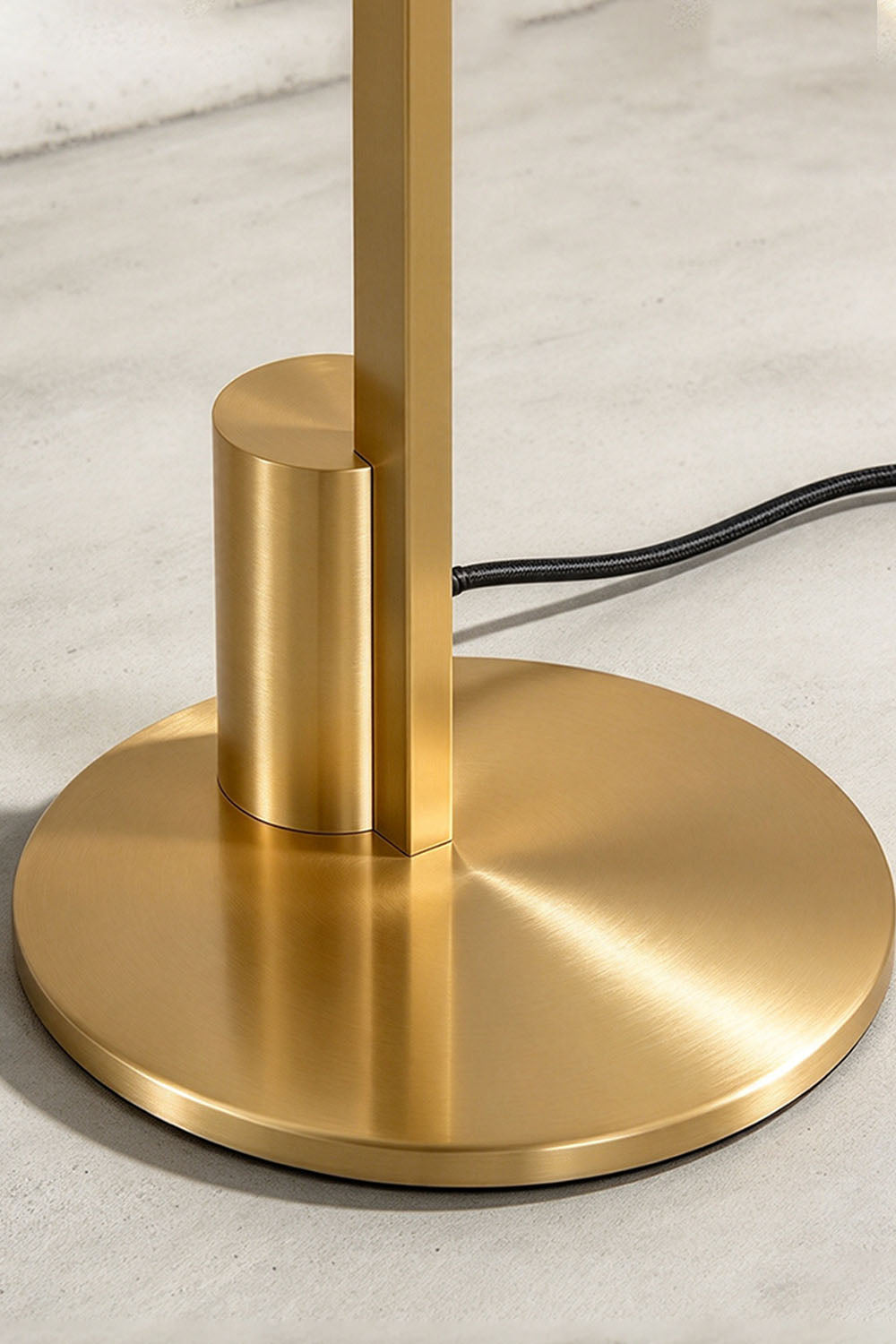 Jonquelle Table Lamp | Solid Brushed Brass | Close-up of heavy circular brass base and support stem | Samu Lamp