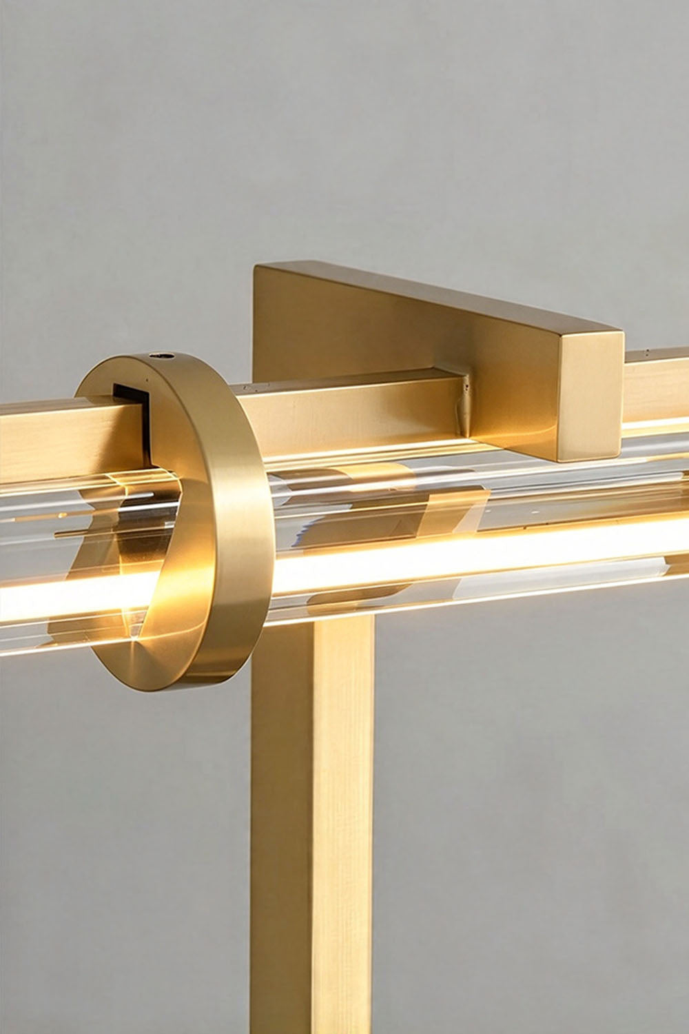 Jonquelle Table Lamp | Solid Brushed Brass | Detailed macro of brass collar ring securing glass rods | Samu Lamp