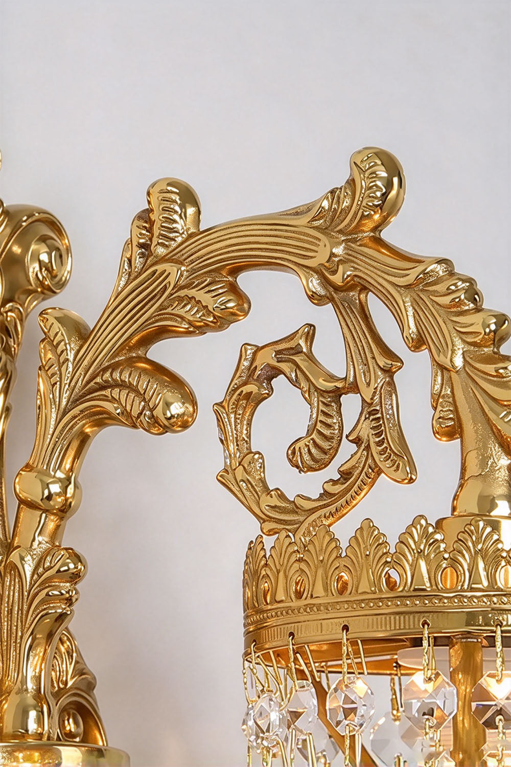 Josseline Brass Crystal Crown Wall Lamp | Cut Crystal and Brass | Detail shot of the ornate brass scrollwork arm and filigree crown rim | Samu Lamp