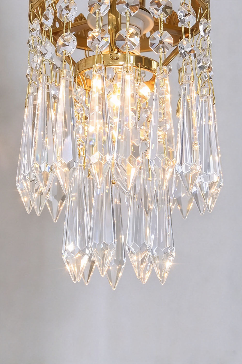 Josseline Brass Crystal Crown Wall Lamp | Cut Crystal and Brass | Product view of the crystal crown shade displaying sparkling glass strands | Samu Lamp