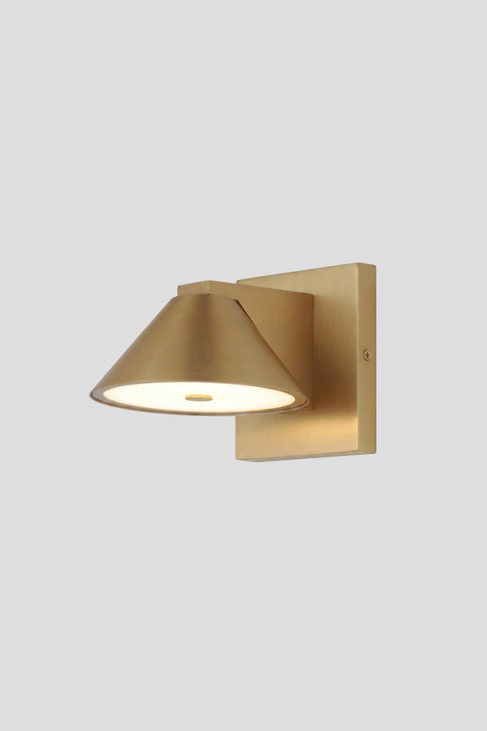 Kaelen Brass Cone Wall Sconce | Studio Lit View | Studio front presentation of the fully illuminated minimalist gold brass cone wall light fixture against a light grey wall | Samu Lamp