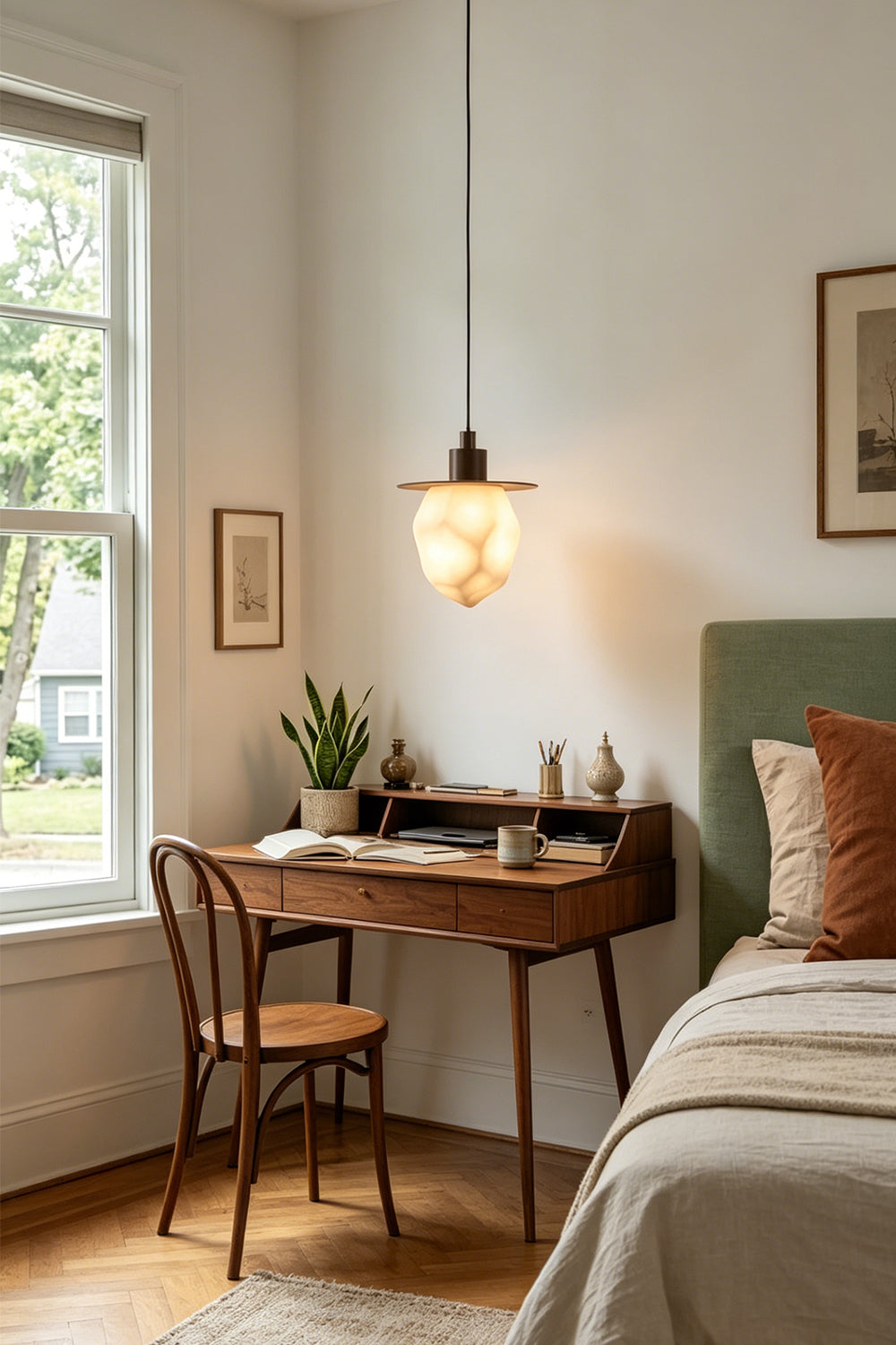 Kaelen Faceted Alabaster Pendant Light | Alabaster, Metal | Styled in a bright contemporary room corner casting a welcoming glow over a small wooden desk near a window | Samu Lamp