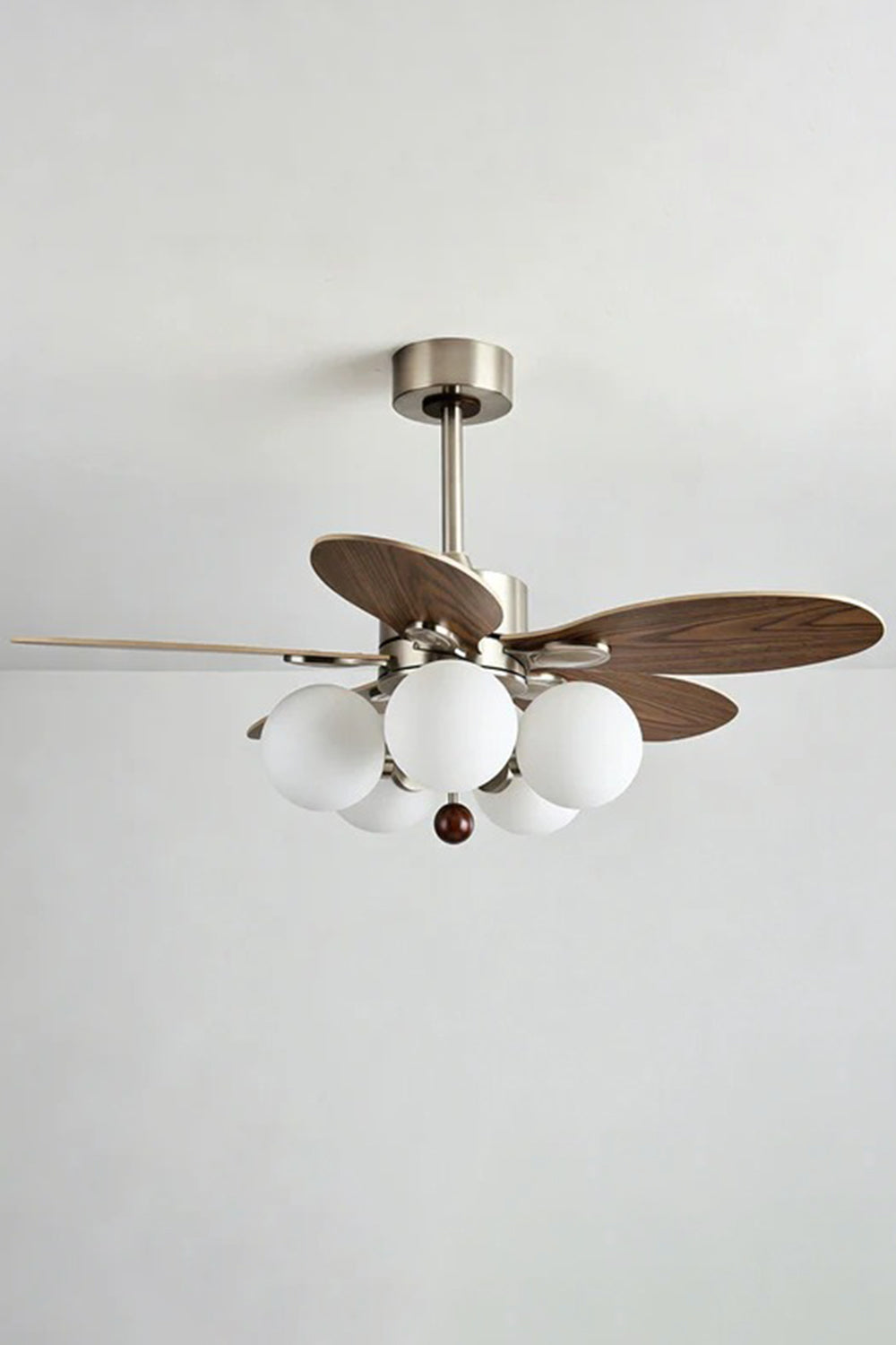 Keller Wooden Ceiling Fan Light | Wood, Glass, Metal | Alternative side studio view of the lit ceiling fan light combo unit against a clean light grey backdrop | Samu Lamp