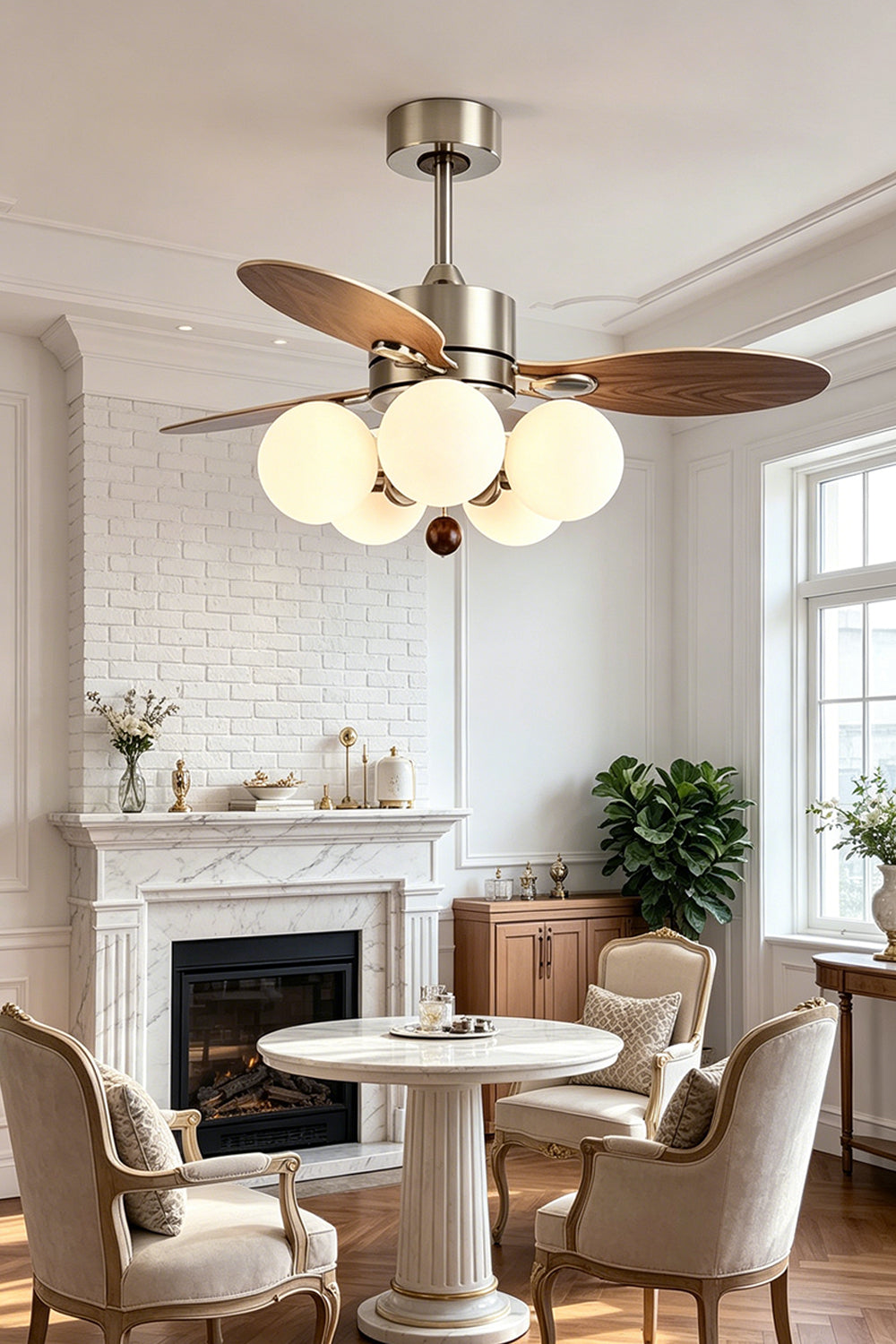 Keller Wooden Ceiling Fan Light | Wood, Glass, Metal | Staged in a cozy lounge room corner near a white fireplace, radiating warm light over traditional armchairs | Samu Lamp