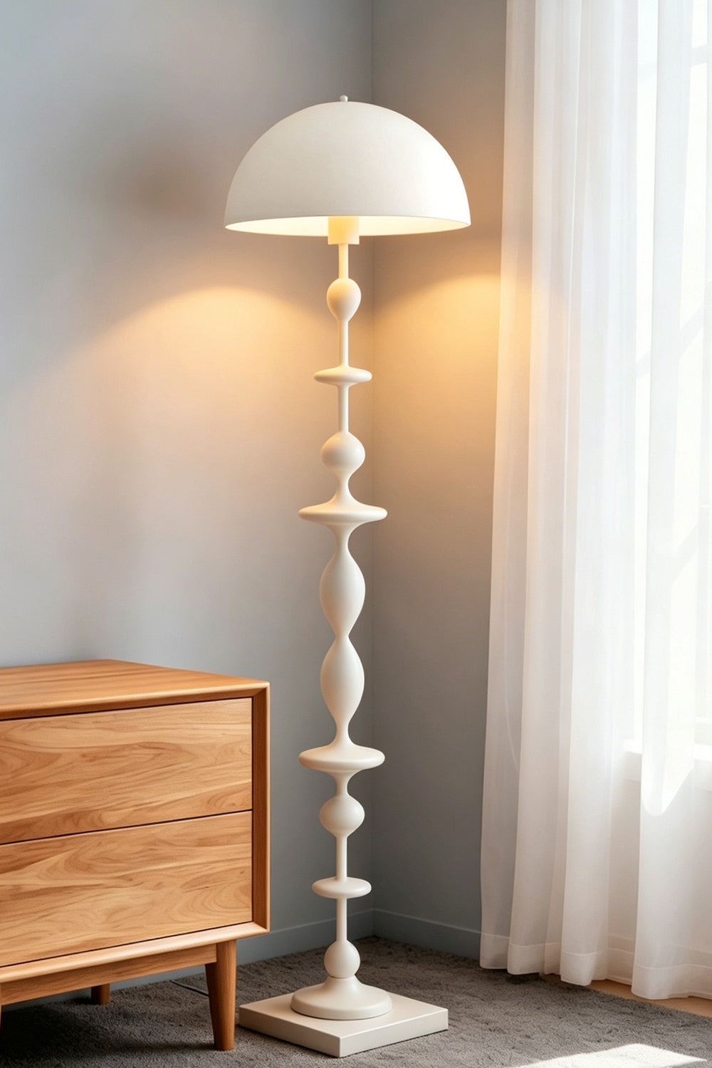Kira Beaded Mushroom Floor Lamp | Metal, Glossy Finish | The white variant illuminated in a cozy bedroom corner next to a wooden dresser and sunlit window | Samu Lamp