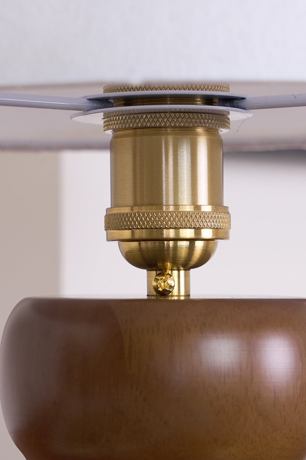 Kira Sculpted Mushroom Table Lamp | Wood, Glass | Internal macro view showcasing the polished gold brass socket neck connector underneath the glass shade structure | Detail shot | Samu Lamp