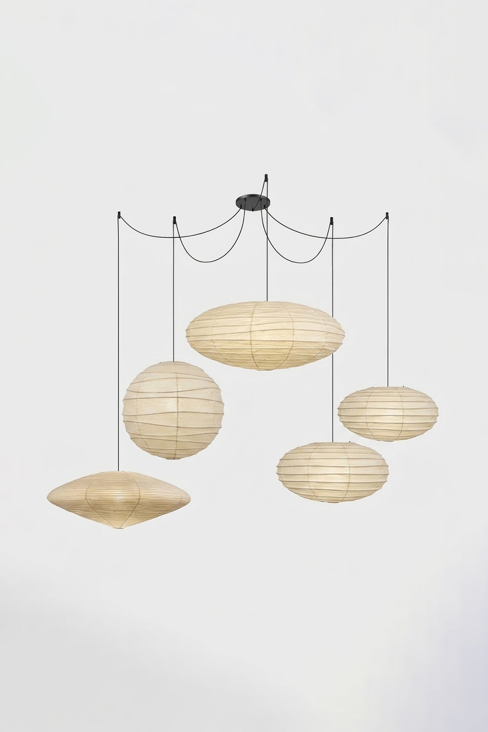 Komorebi Mulberry Paper Pendant Light | Paper, Bamboo | Studio view of a multi-cord 5-light unlit paper pendant cluster configuration hung from a central black canopy | Samu Lamp