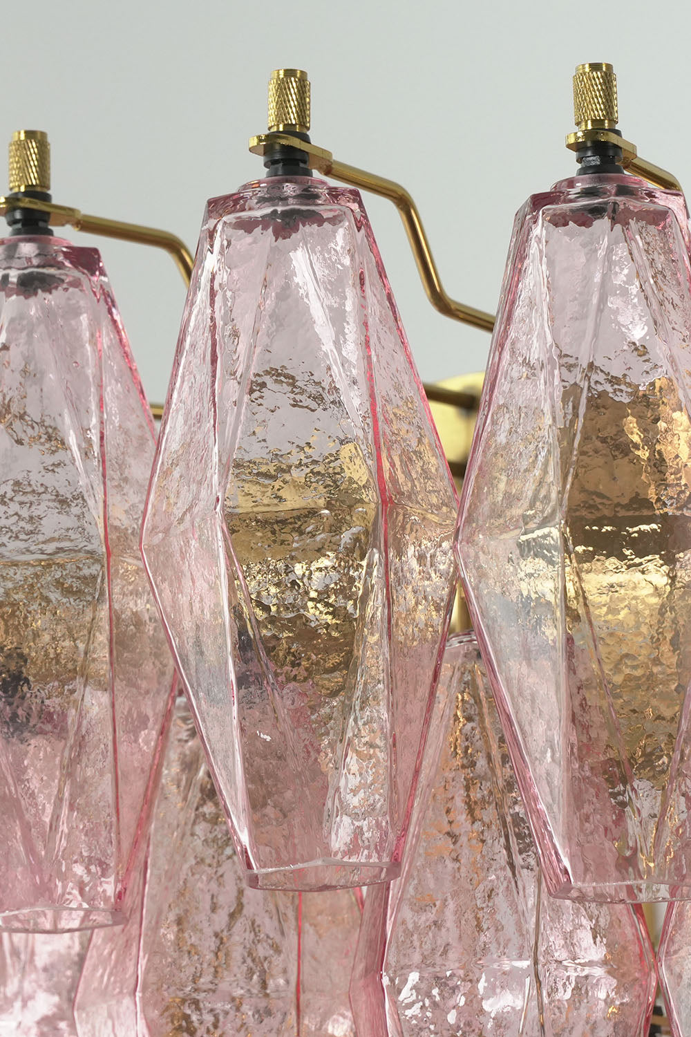 Lauragne Pink Faceted Glass Cascade Chandelier | Pink Faceted Glass and Brass | Detail shot highlighting pink faceted glass prisms hanging on brass loops | Samu Lamp