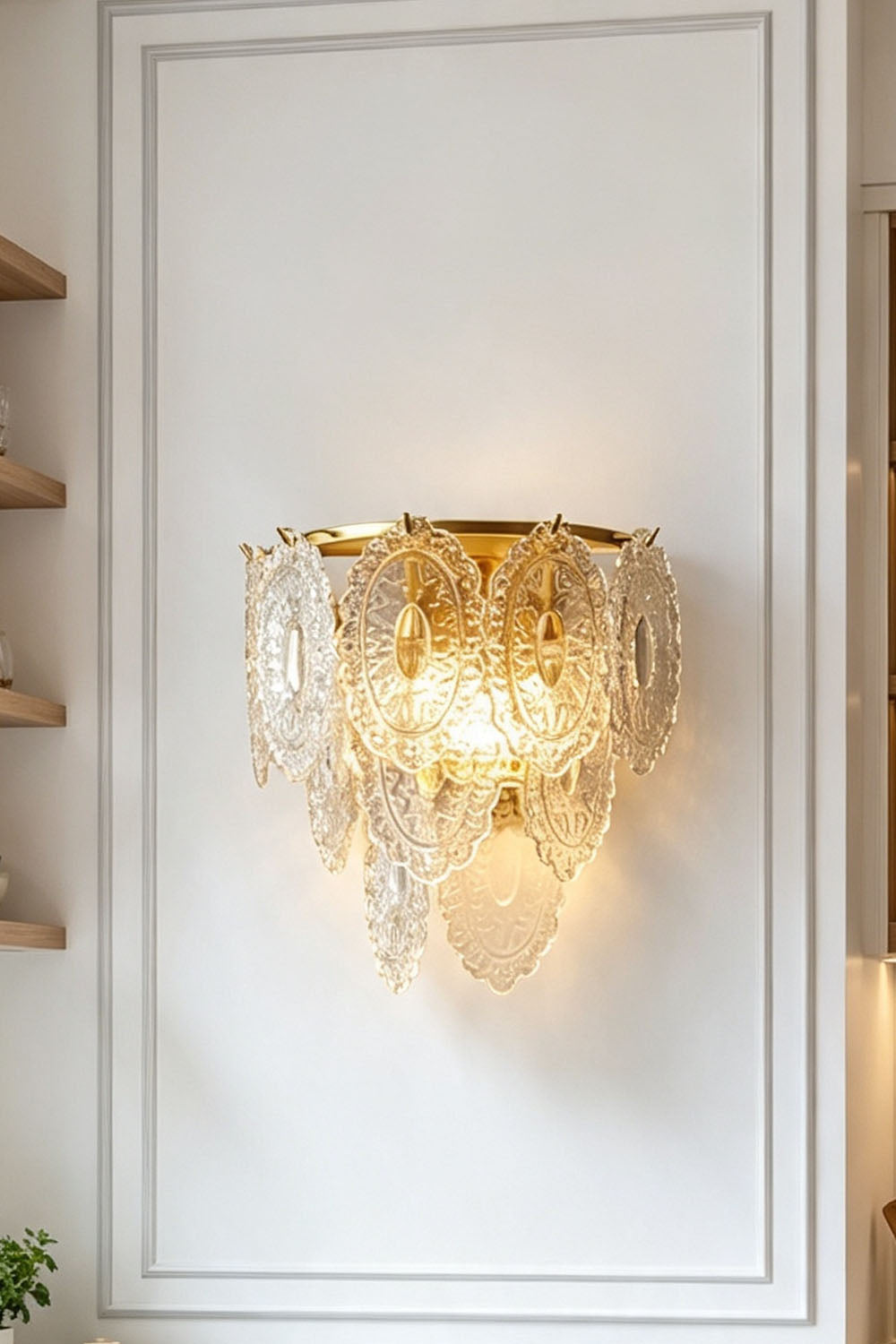 Lavinia Pressed Glass Tier Wall Sconce | Pressed Glass and Brass | Front illuminated view mounted centrally on a white paneled wall | Samu Lamp