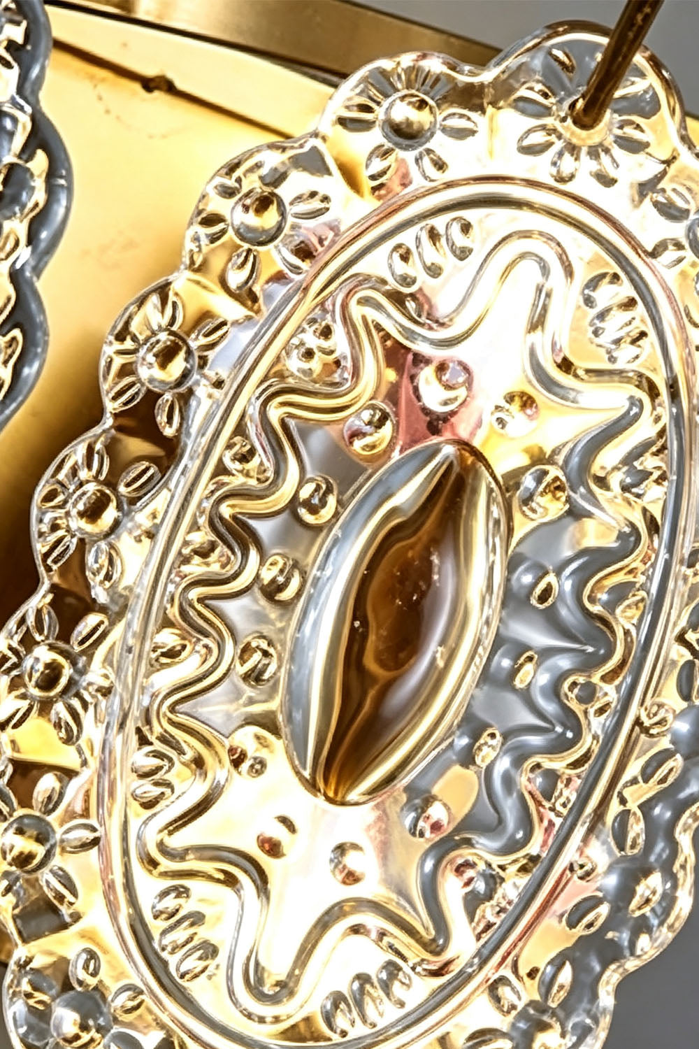 Lavinia Pressed Glass Tier Wall Sconce | Pressed Glass and Brass | Macro detail of the vintage floral texture on a single glass piece | Samu Lamp