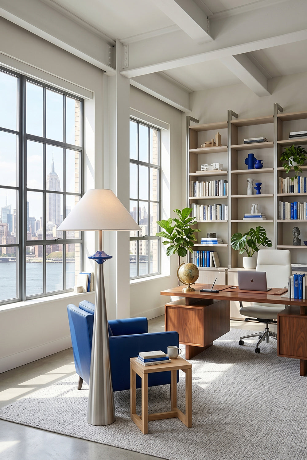 Lazuro Postmodern Cone Floor Light | Metal, Fabric | Placed in a sunlit industrial loft office corner next to a blue accent armchair and a large wooden executive desk | Samu Lamp