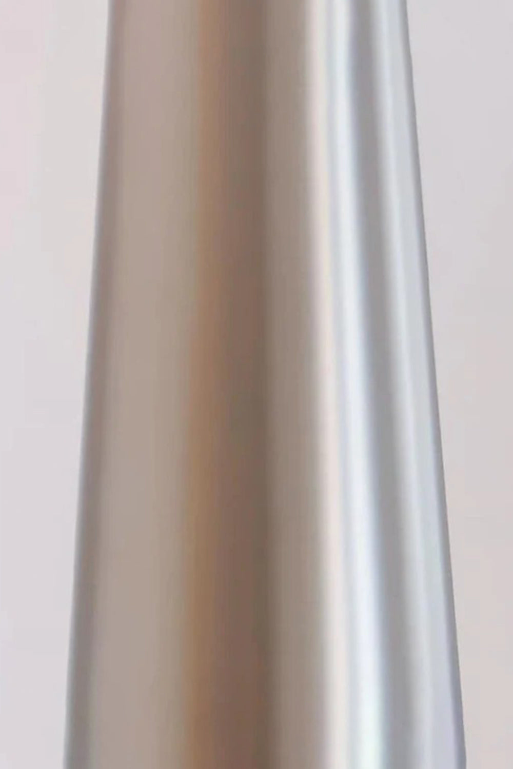 Lazuro Postmodern Cone Floor Light | Metal, Fabric | Macro close-up focus on the sleek brushed chrome silver finish of the tall tapered cone metal stem | Detail shot | Samu Lamp