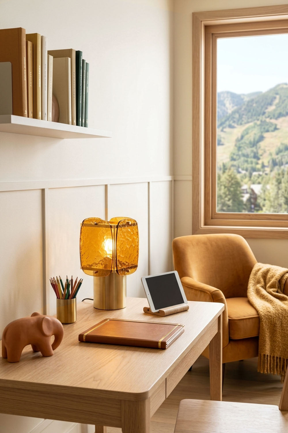 Lesquin Hammered Amber Glass Table Lamp | Hammered Amber Glass and Brass | Styled on a study desk beside a leather armchair near a window | Samu Lamp