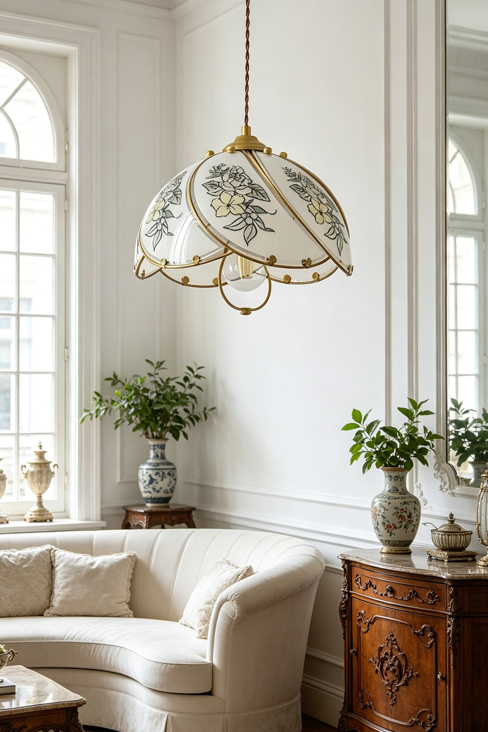 Lillian Retro Floral Pendant Lamp | Glass, Metal | Providing an elegant centerpiece above a curved cream sofa in a sunlit classic living room with arched windows | Samu Lamp