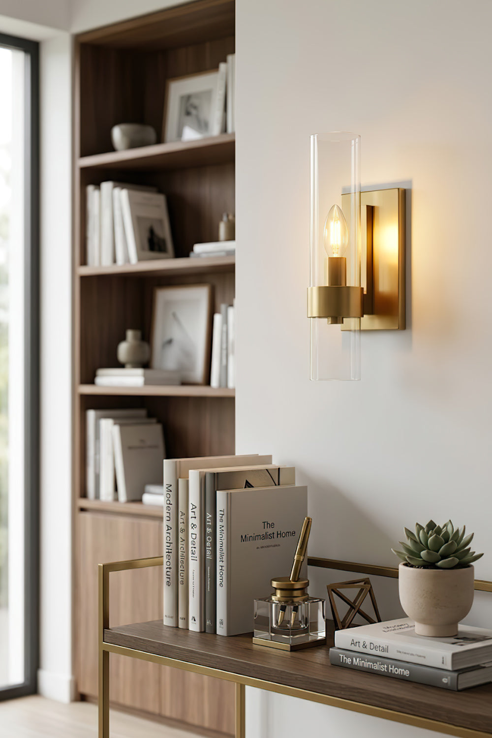 Linear metallic brass sconce | Brass, Glass | Mounted on a wall in a home office with bookshelves | Samu Lamp