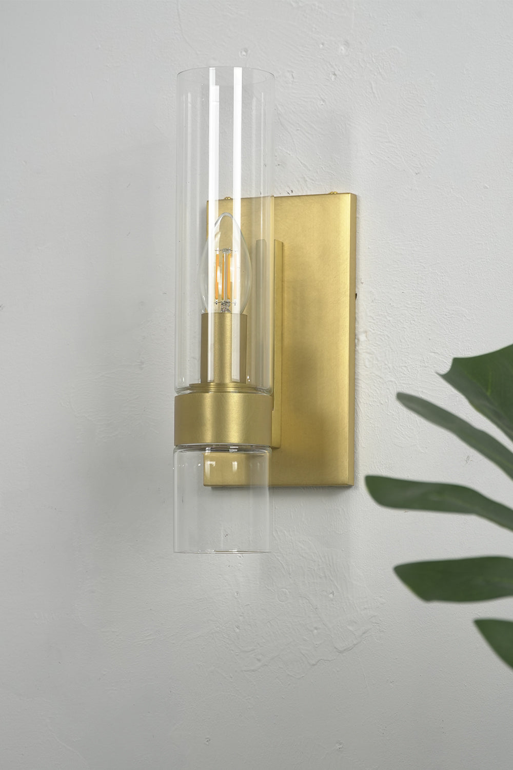 Linear metallic brass glass wall sconce | Brass, Glass | Close-up view on a clean white wall | Samu Lamp